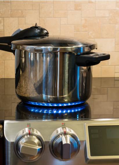 This photo is showing grains, nuts, seeds, and beans in a pressure cooker for a better preparation for your plant-based diet.