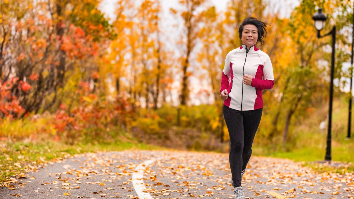 Jogging middle aged woman autumn | Stop Inflammaging in its tracks for healthier aging | Creative Balance Health