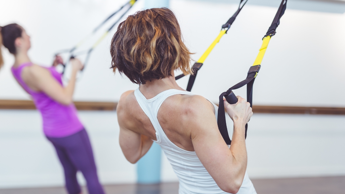 2 women doing TRX exercise | 3 Ways to Reduce Inflammaging & Boost Health Over 50 | Creative Balance Health